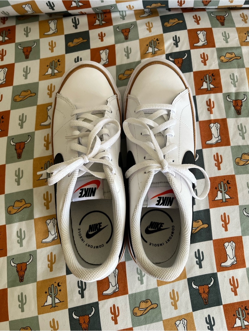Nike Kids White Sneakers with Black Swoosh and Gum Trim